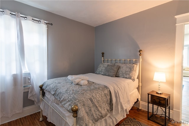 bedroom featuring cooling unit and wood-type flooring