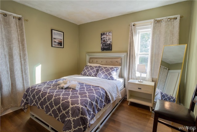 bedroom featuring dark hardwood / wood-style floors