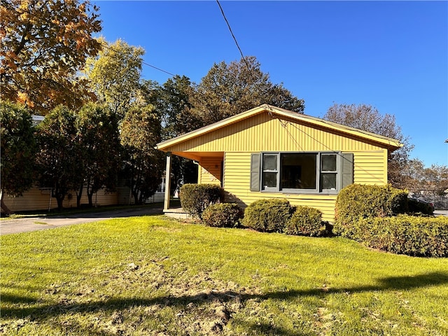 view of home's exterior with a yard