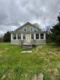 back of house with a yard and a deck