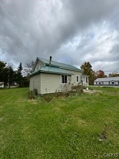 view of property exterior featuring a yard