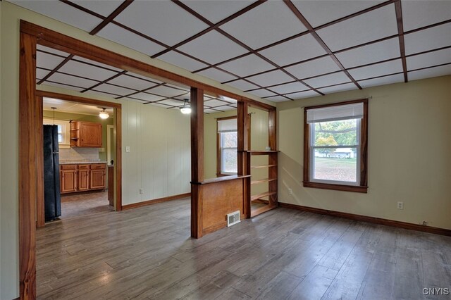 spare room with light hardwood / wood-style flooring