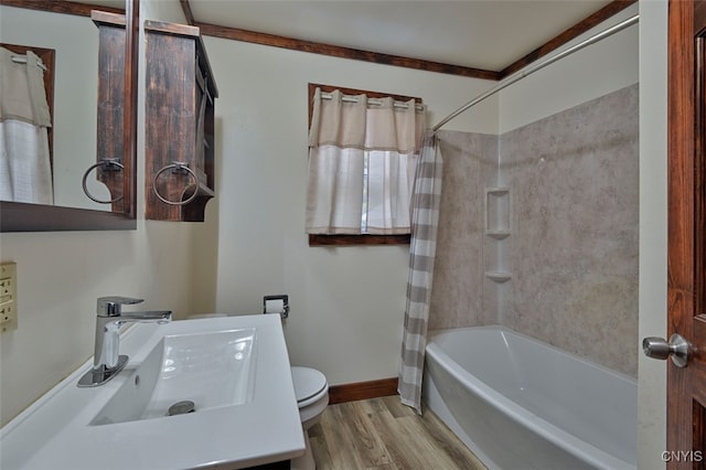 full bathroom with vanity, shower / bath combo, wood-type flooring, and toilet