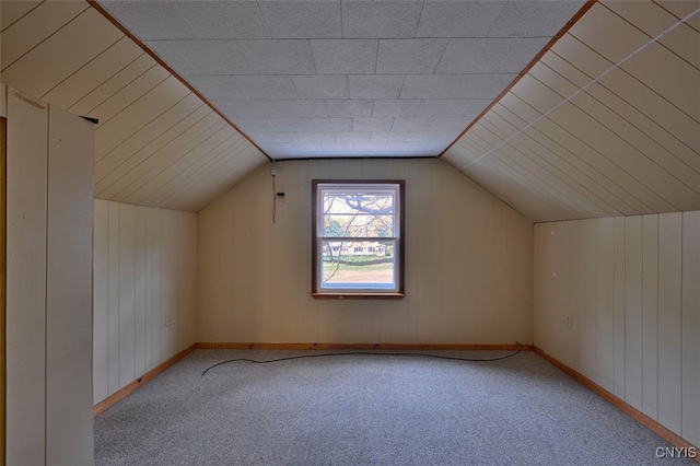 bonus room featuring light carpet and lofted ceiling