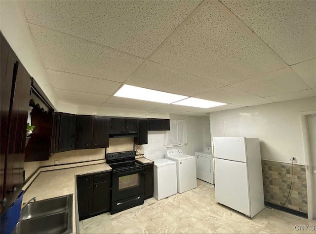 kitchen with sink, black range with electric stovetop, independent washer and dryer, a paneled ceiling, and white refrigerator