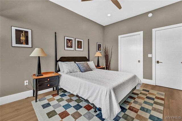 bedroom with hardwood / wood-style flooring and ceiling fan