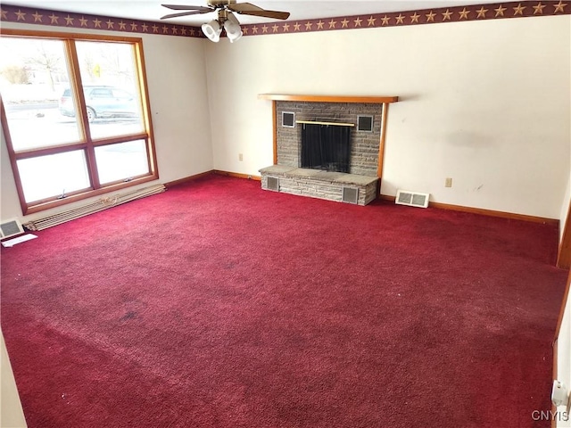 unfurnished living room featuring ceiling fan, carpet floors, baseboard heating, and a brick fireplace