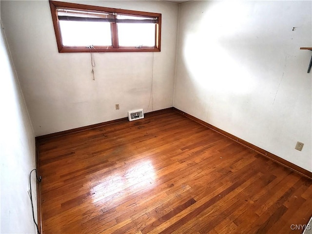 unfurnished room featuring hardwood / wood-style floors