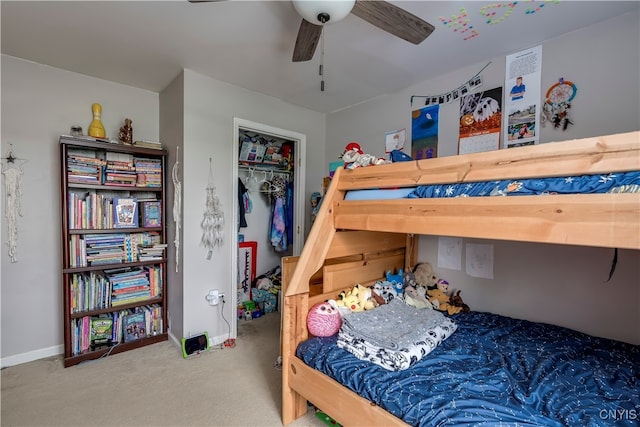 carpeted bedroom featuring a closet and ceiling fan