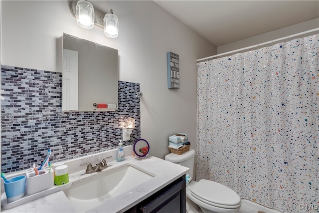 bathroom with vanity, toilet, decorative backsplash, and a shower with curtain