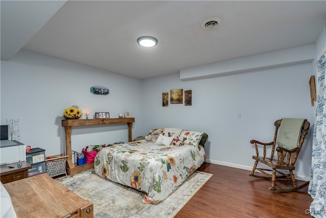 bedroom featuring dark wood-type flooring