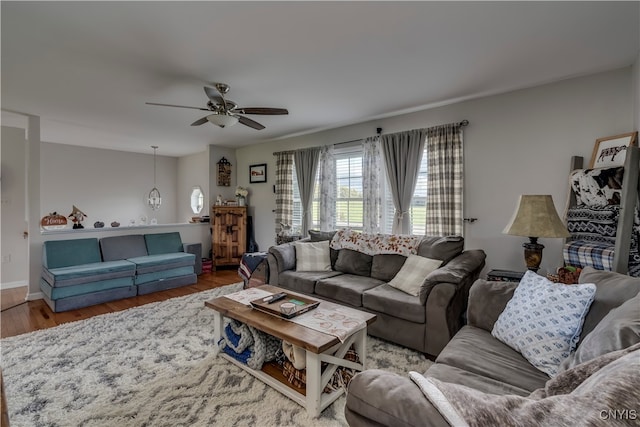 living room with hardwood / wood-style floors and ceiling fan