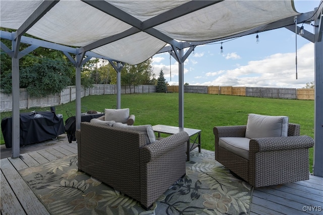 wooden deck featuring a yard and area for grilling