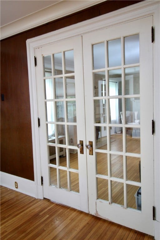 entryway featuring french doors and hardwood / wood-style flooring