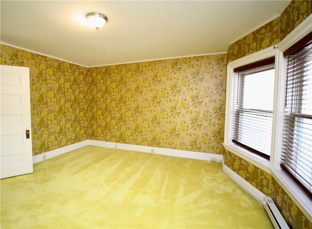 unfurnished room featuring ornamental molding and a baseboard radiator