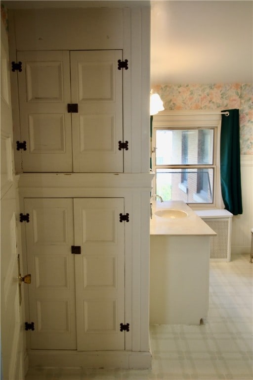 bathroom featuring vanity and radiator heating unit