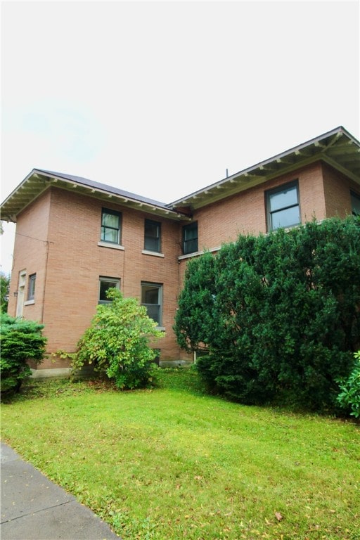 view of home's exterior featuring a yard