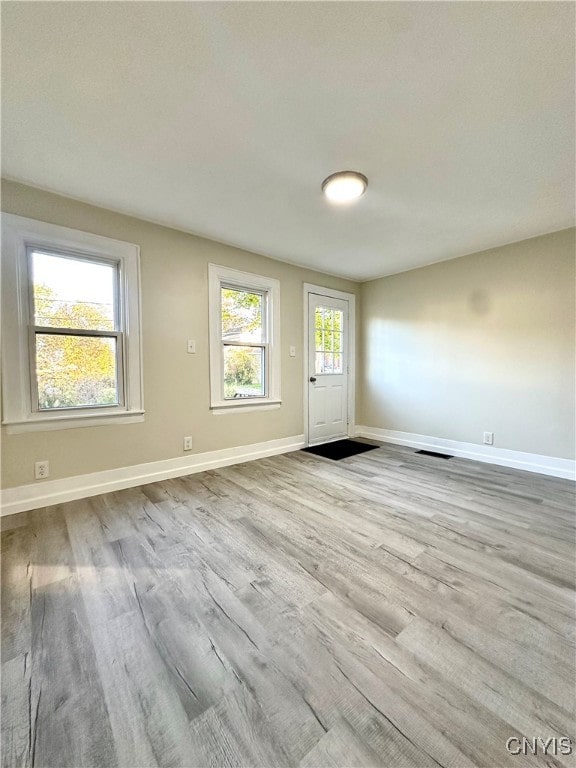 spare room featuring light hardwood / wood-style flooring