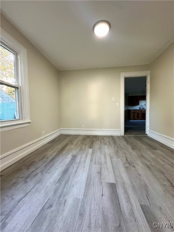 spare room featuring light hardwood / wood-style flooring