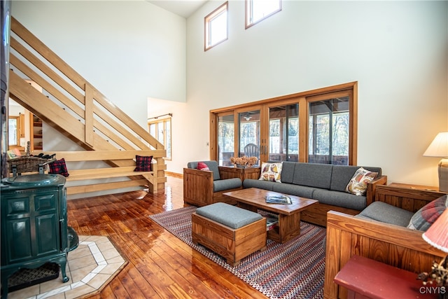 living room featuring hardwood / wood-style floors and a high ceiling