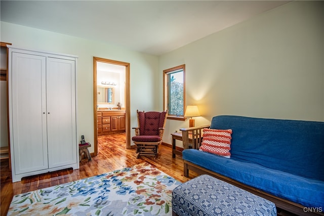 sitting room featuring light hardwood / wood-style floors and sink