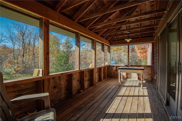 unfurnished sunroom with lofted ceiling and a wealth of natural light