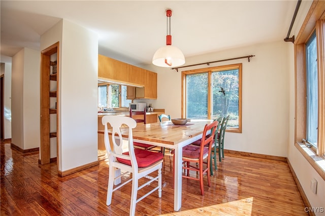 dining space featuring light wood-type flooring