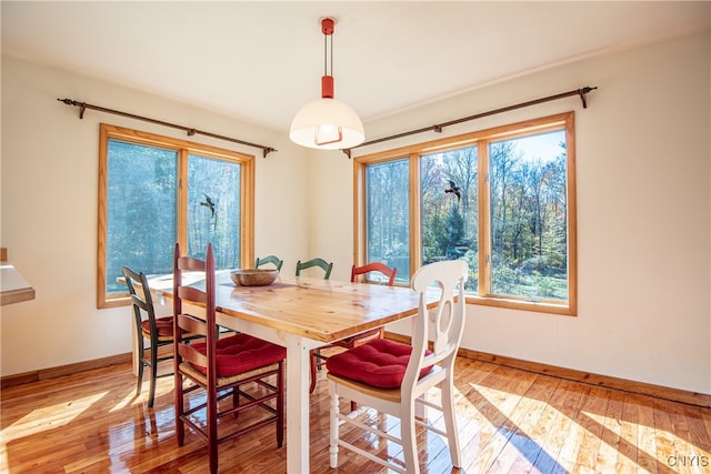 dining area featuring light wood-type flooring