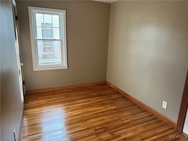 unfurnished room with light hardwood / wood-style flooring