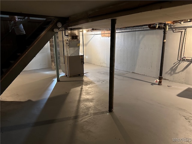 basement featuring heating unit