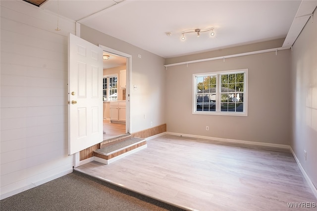 spare room with hardwood / wood-style flooring