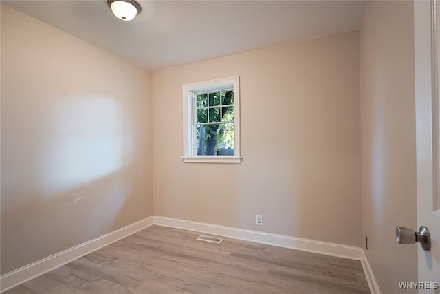 unfurnished room with light hardwood / wood-style floors