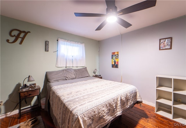 bedroom featuring dark hardwood / wood-style floors and ceiling fan