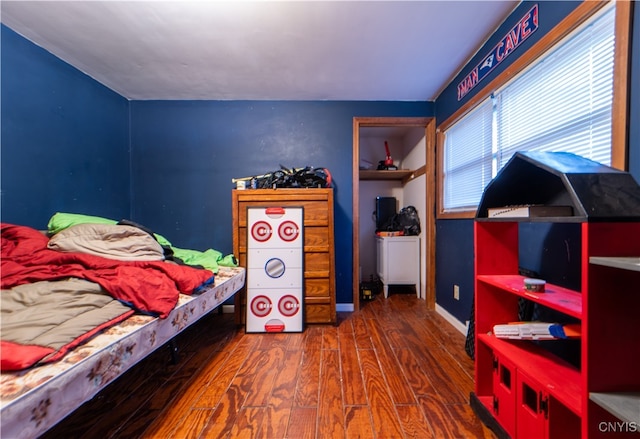 bedroom with hardwood / wood-style floors