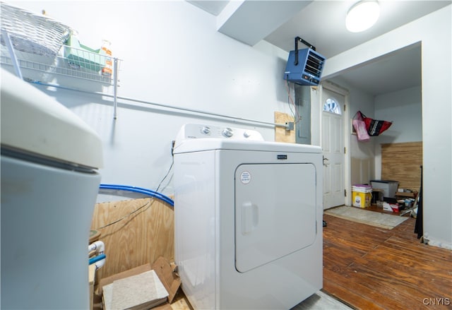 clothes washing area featuring washer / dryer and hardwood / wood-style flooring