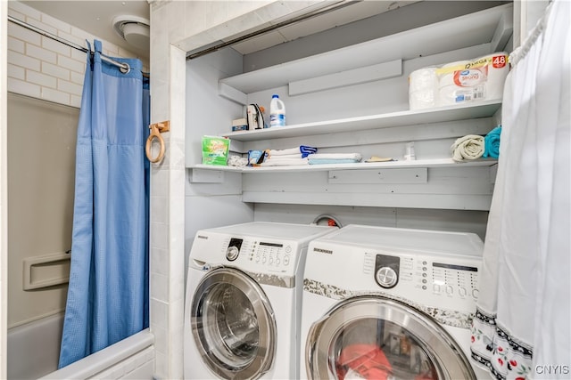 laundry area with washing machine and dryer