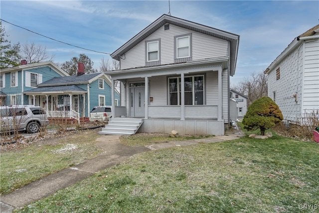 view of front of home with a front lawn and a porch