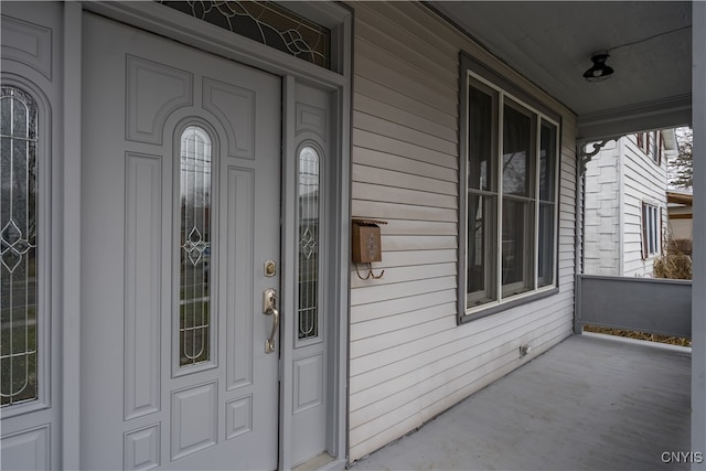 entrance to property featuring a porch