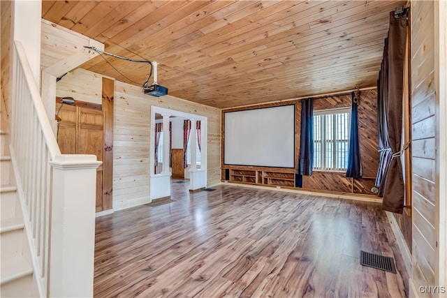 bonus room featuring wood ceiling, hardwood / wood-style flooring, and wooden walls