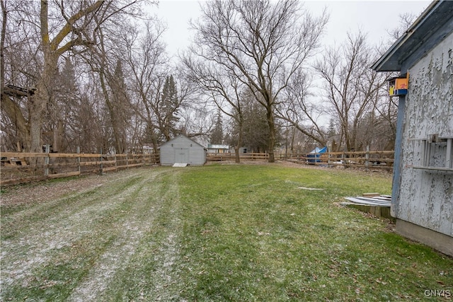 view of yard featuring a storage unit