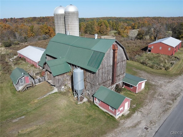 drone / aerial view featuring a forest view