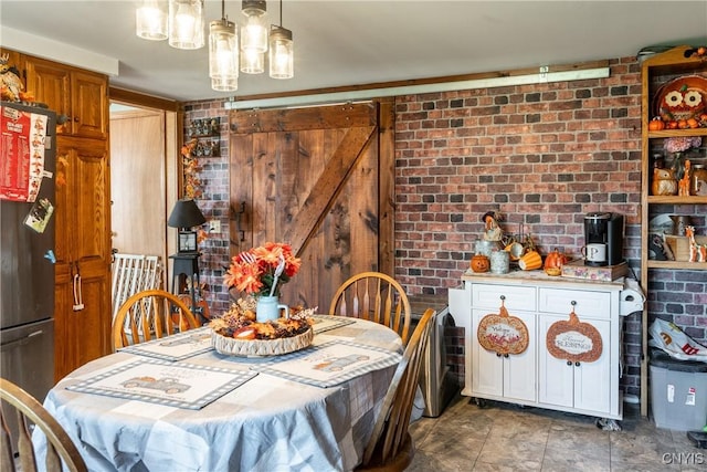 dining space featuring brick wall