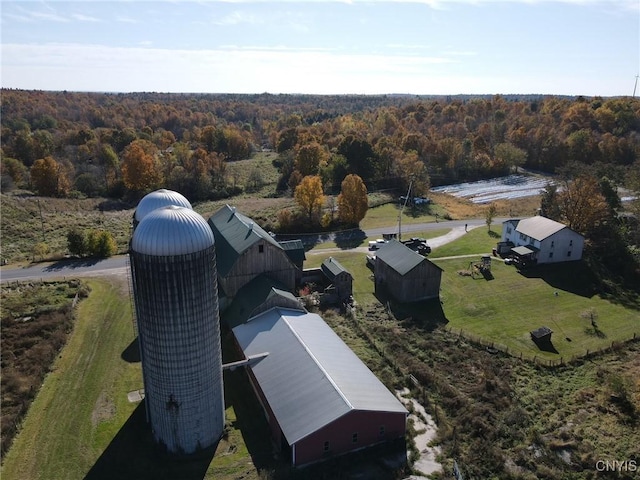 drone / aerial view featuring a forest view