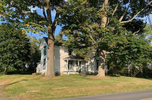 view of side of property with a yard