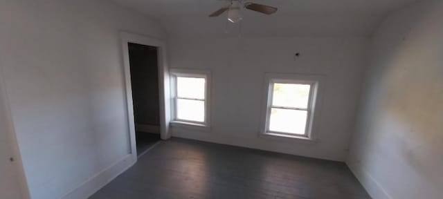 spare room featuring ceiling fan, lofted ceiling, and dark hardwood / wood-style floors