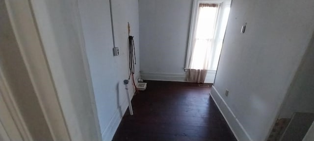 hall with dark hardwood / wood-style flooring