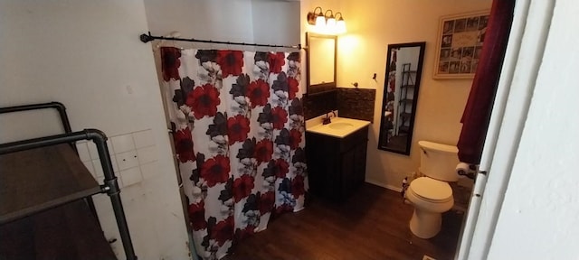 bathroom with vanity, wood-type flooring, toilet, and walk in shower