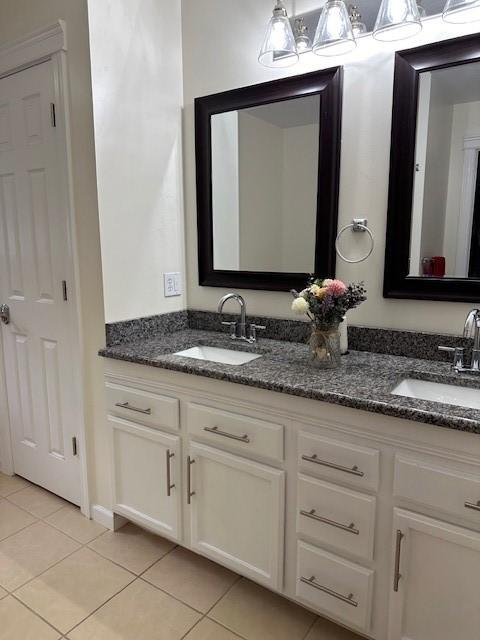 bathroom with vanity and tile patterned floors