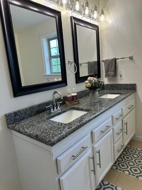 bathroom with tile patterned flooring and vanity