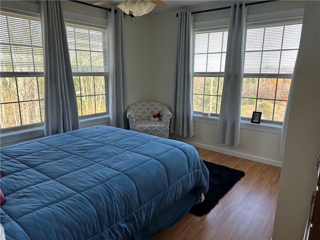 bedroom with hardwood / wood-style floors